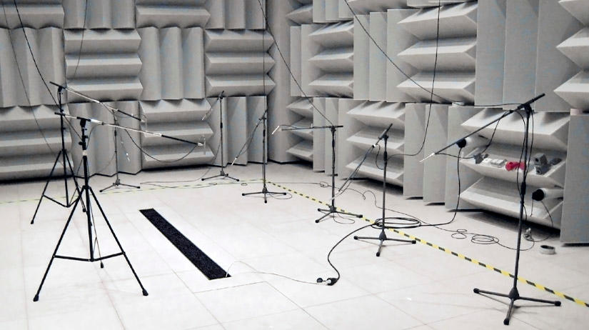 Experimental setup in the sound-chamber with built-in fan coil in the entrance area, microphones were placed in front of it